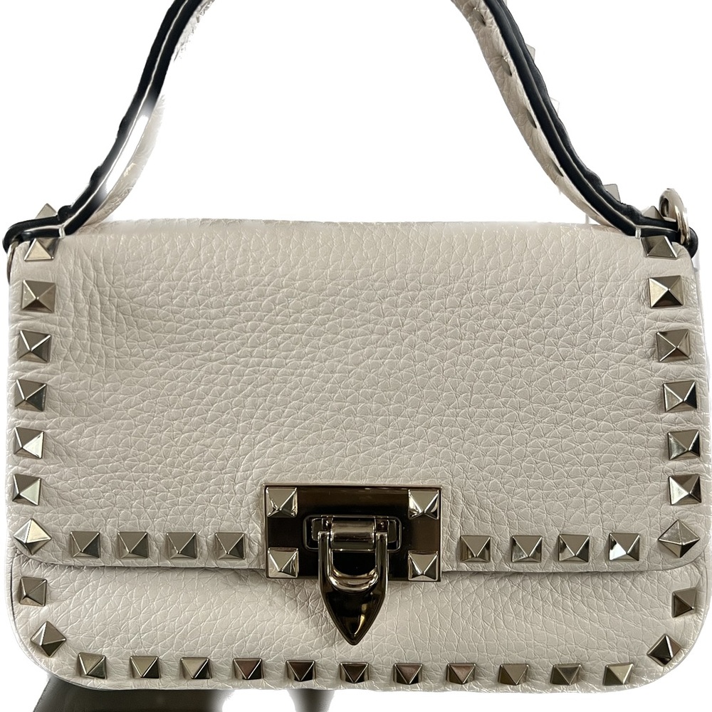 New, has two detachable straps, a shoulder strap and a belt strap.